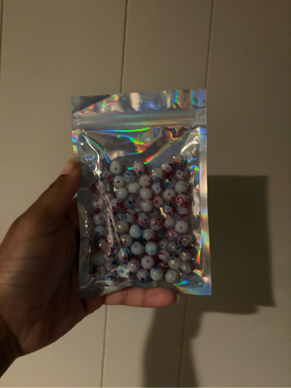 Holographic Resealable Bag of White Beads with Red & Blue Speckles